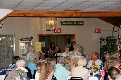 2012 Banquet Class of 1942
Class of 1942 70th Anniversary Recognized. 
L to R: Mary DelaRoche LaFave; Kathryn Woodard Hite; Margaret Rush Smolenski (back to camera; Elizabeth Gamble? (hidden)
Attending, but not IDed: Harriet Kirby Armstrong
