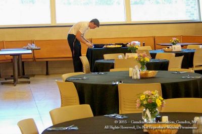 2015 Alumni Banquet June 13
Caterer setting tables.
